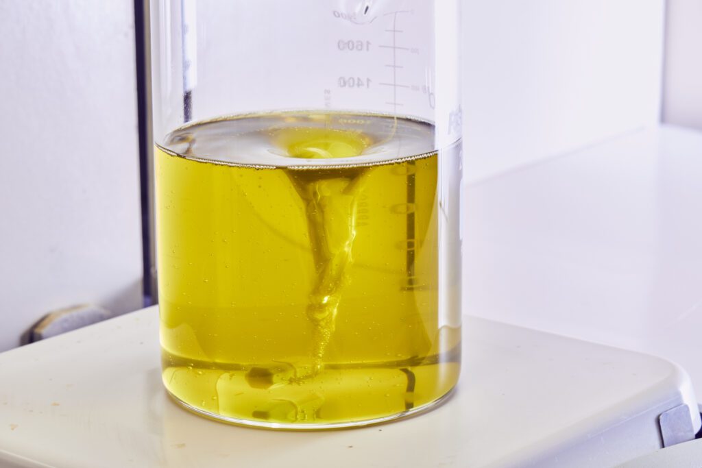 Solvents and ingredients in a beaker - one of the green chemistry principles